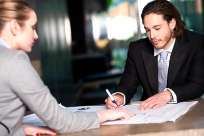 Employee Reviewing Papers